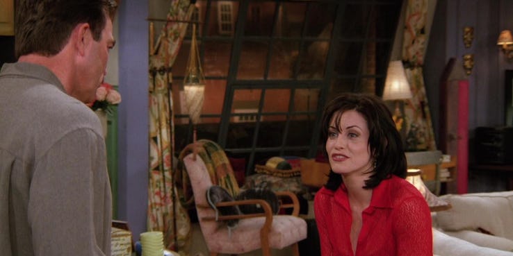 Courtney Cox as Monica speaks to Tom Selleck as Richard on Friends